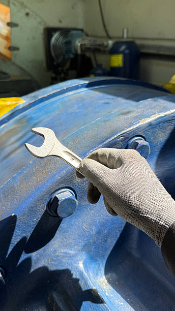istock Technician holding wrench getting ready for maintenance work in a top of a wind turbine. 2210970874