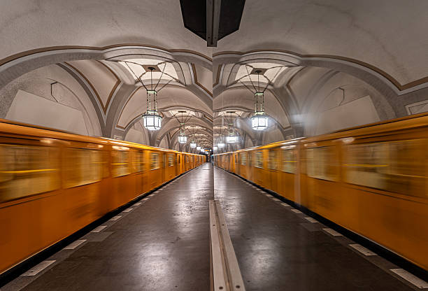 Germany, Berlin, Subway station Heidelberger Platz, April 08, 2025 - Blurred motion of a Berlin subway with reflection in Heidelberger Platz station