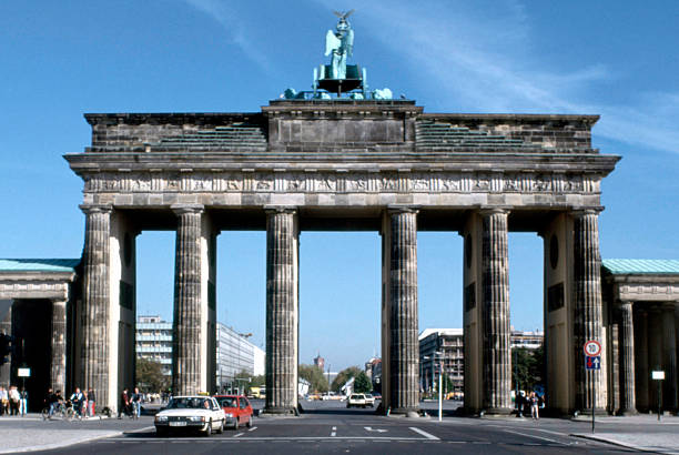 Brandenburg Gate with a view from the west side of the street Unter den Linden in the former eastern part of Berlin - Germany.