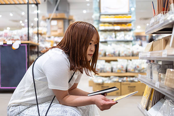istock Young woman shopping in general store 2210983110