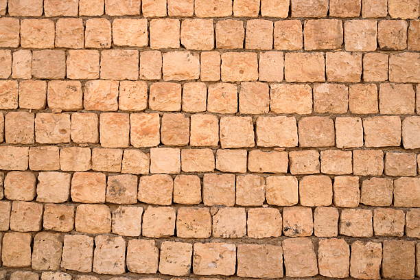 Brick wall texture. Orange yellow red brick building wall, Iraq in Middle East