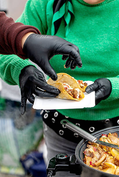 istock Taco Serving with Black Gloves 2210986333