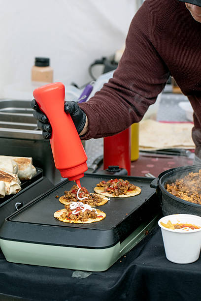istock Chef Preparing Street Tacos With Sauce 2210986339