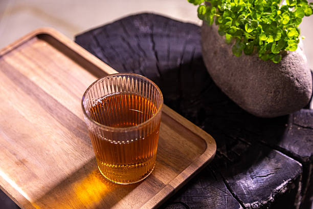 Glass teacup and green plants, do