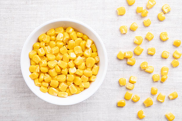 istock Canned vegetable maize, sweet corn in white bowl on linen 2210989152