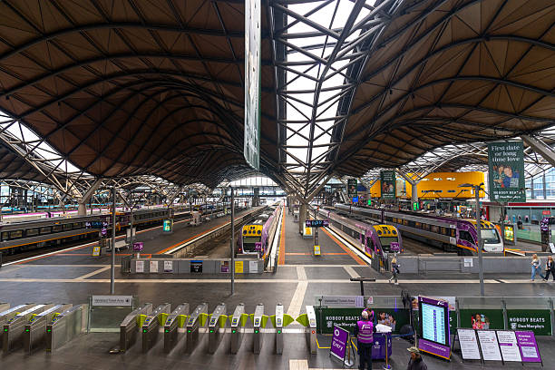 Melbourne, Australia - July 8, 2024 : Many passenger walking inside Southern Cross railway station building in Melbourne, Australia on July 8, 2024.