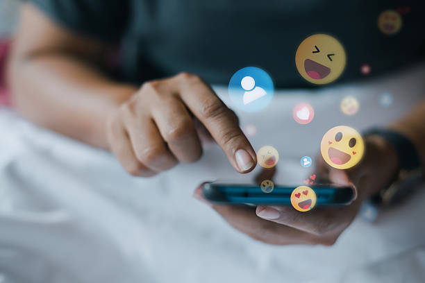 istock Using smartphone for social media reactions 2210991503
