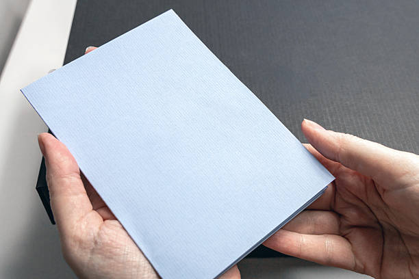 istock Female hands holding a blank pastcard 2210993409