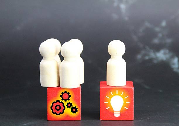 istock peg dolls, colored cubes with Idea and teamwork icons 2210993844