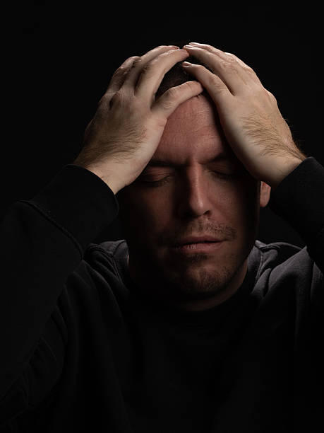 istock Man Expressing Frustration in Dramatic Portrait 2210994239