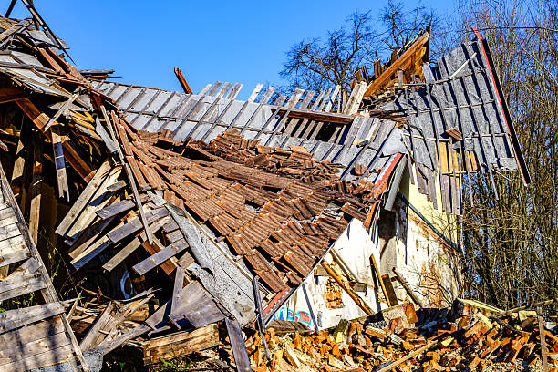 istock Old building ruins show significant collapse and damage in bright daylight with blue sky background 2210996802
