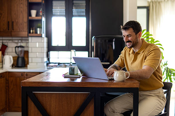 istock Mid Adult Man Working Remotely from Home 2211001133
