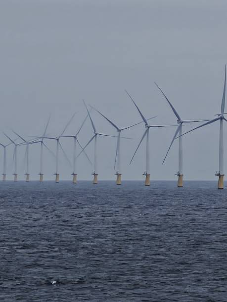 istock Windmills on the ocean 2211008960