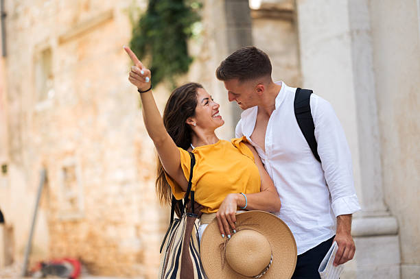 istock Young romantic couple walking throughout old town city 2211010053