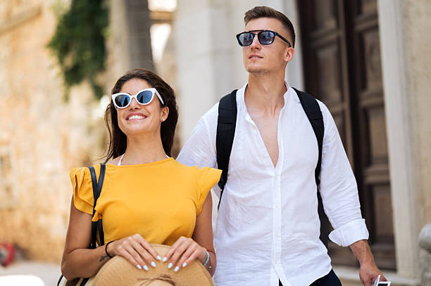 istock Young romantic couple walking throughout old town city 2211010083