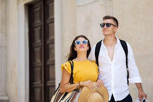 istock Young romantic couple walking throughout old town city 2211010117