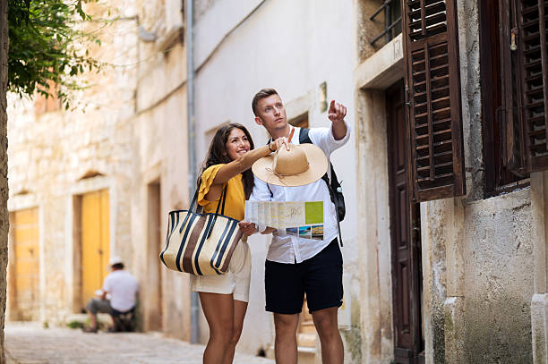 istock Young romantic couple walking throughout old town city 2211010145