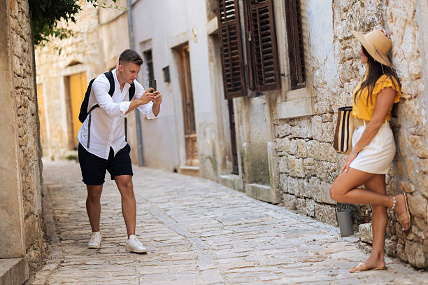 istock Young beautiful couple in love taking selfie 2211010266