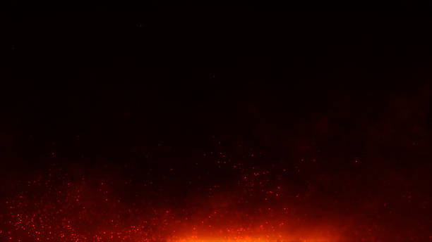 istock Fiery glowing particles and burning sparks flying in dark background. Abstract flame and ember texture with heat and energy atmosphere. Perfect for fire concepts, backgrounds, and special effects. 2211015368