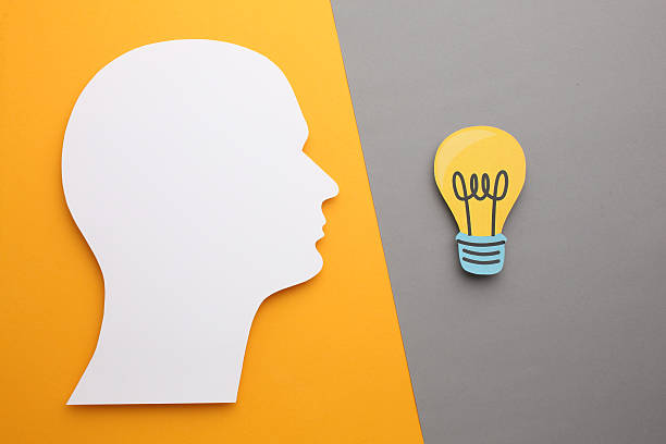 istock Creative thinking ideas and innovation concepts. Yellow coloured light bulb on the background 2211016460