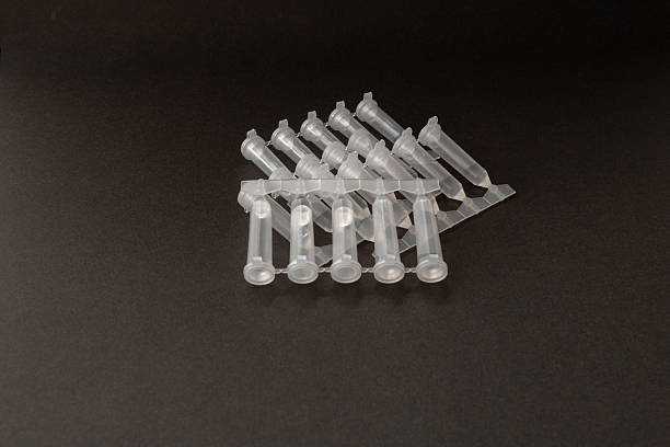 istock Disposable eye drops isolated on dark background. Pack of eye drops single use containers. Eye care concept. dry eye treatment 2211018839