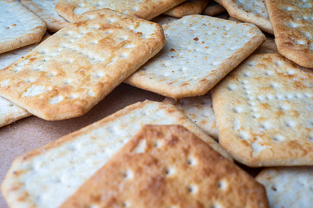 istock Cracker cookies lying on food paper 2211019580