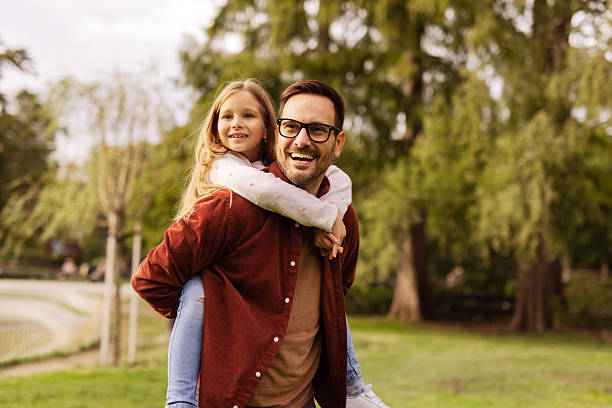 istock Child Enjoying Time with Father in Nature 2211019915