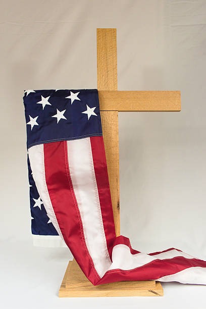 istock An American flag draped over a cross 2211021344