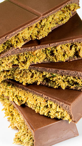 istock Trend Dubai Chocolate Bar with Green Kadayif Pistachio Paste and Peanut Butter on White Background 2211024095