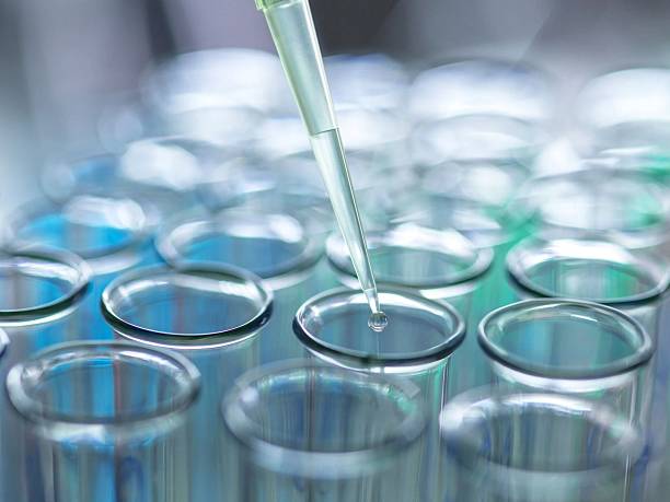 istock A pipette dispensing liquid into test tubes, symbolizing scientific experiments and research endeavors. 2211024875