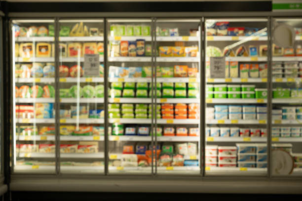 istock Refrigerated dairy products displayed on shelves in supermarket refrigerator 2211024941
