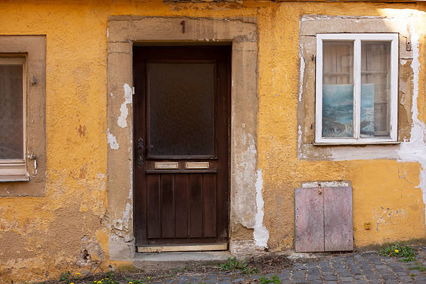 istock Facade – Aged Door and Peeling Paint 2211028846