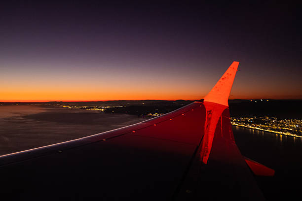 Airplane taking off at night dusk wing right window view sight