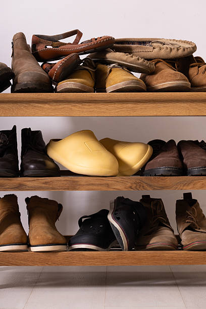 istock Stylish interior of modern hall with shoes on stand 2211030821