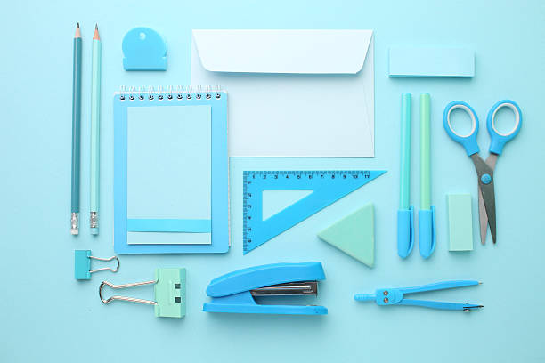 istock Stationery calculator ruler calculator and school stuff on coloured background. Concept of school and college learning 2211030979