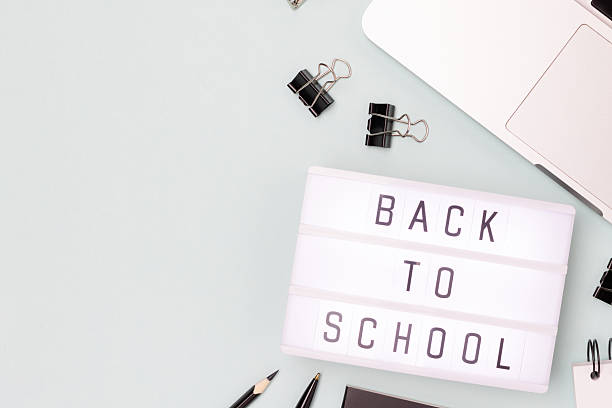 istock Back to school. Lightbox, laptop and office supplies on a blue background. 2211031079