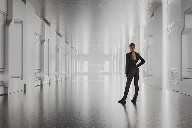 istock Woman standing in futuristic corridor 2211033652