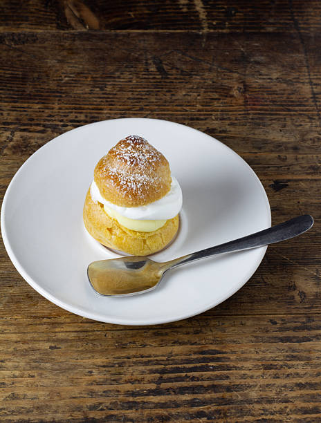 Cream puffs on a white plate