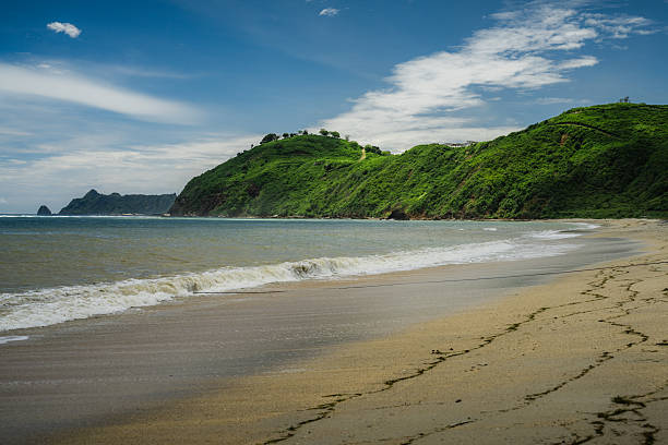 Empty beach and hillside on tropical island, Lombok