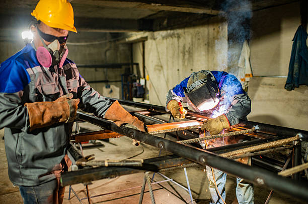 istock Structural welding on construction site with personal protective equipment - stock photo 2211053129