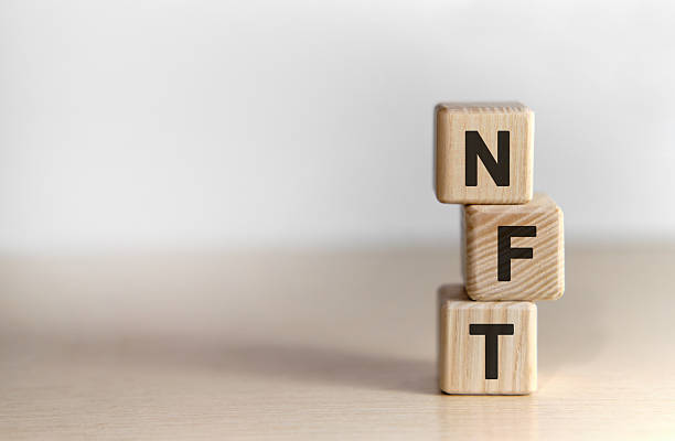 istock NFT - text on wooden cubes 2211053702
