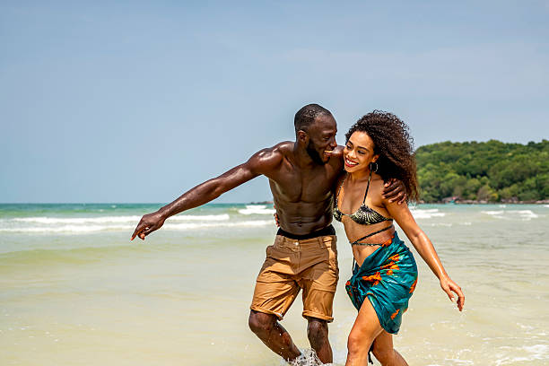 istock Happy Couple Enjoying a Tropical Beach Vacation 2211061284