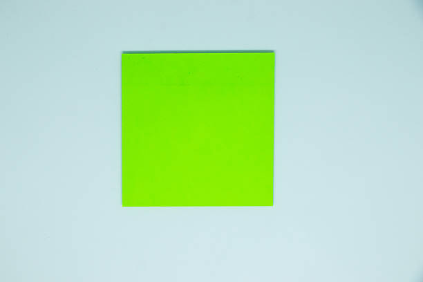 Blank green post-it note isolated on white