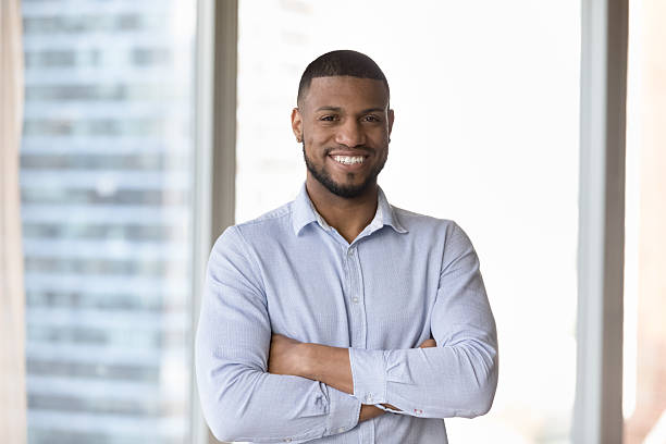 istock Millennial successful businessman posing in modern skyscraper office 2211063941
