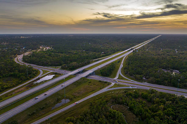 istock American highway bridge with fast moving traffic in evening. Interstate transportation concept 2211065366