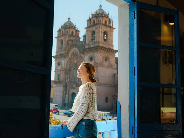 istock Woman looking at Plaza de Armas in Cusco, Peru from balcony 2211066283