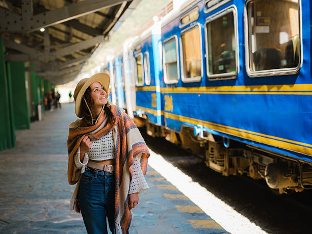 Woman boarding Machu Picchu train in Peru during her experiential trip
