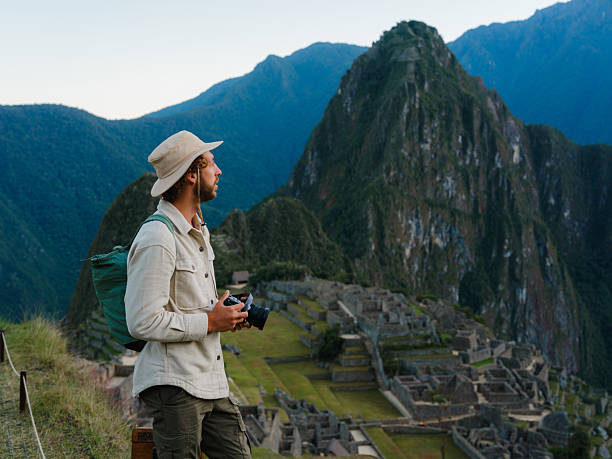 istock Man with camera photographing in Machu Picchu, Peru 2211067049