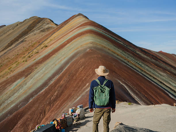 istock Serene man near Vinicunca Rainbow mountains in Peru 2211067258