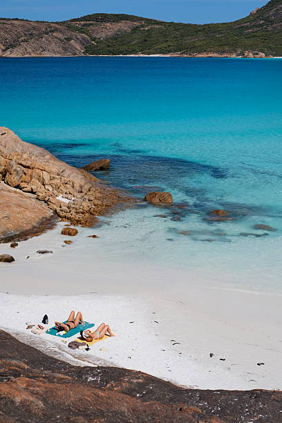 istock Two women relaxing at Thistle Cove, Western Australia 2211068950